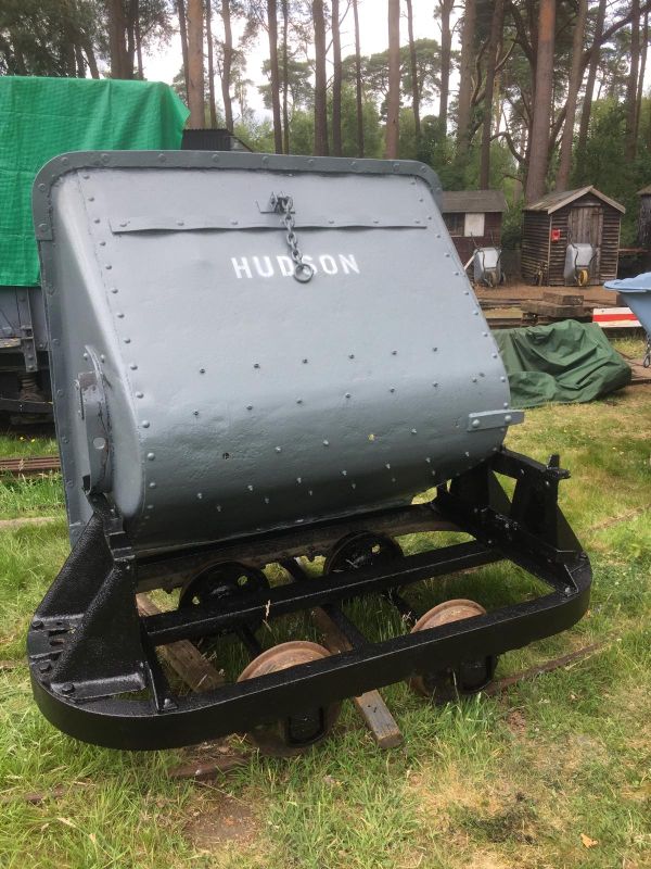 An upturned wagon with the words 'Hudson' written on it, nicely painted in silver.